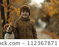 A boy with his best friend, his dog in a forest 112367871