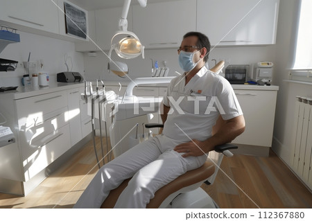 patient sitting in the chair in a dental clinic patient sitting in the chair in a dental clinic 112367880