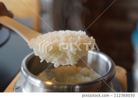 steamed sticky rice in stainless steel pot, korean style food 112368030