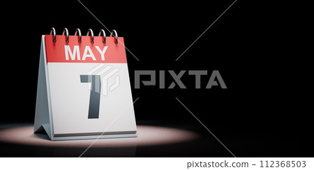May 7 Calendar Spotlighted on Black Background 112368503