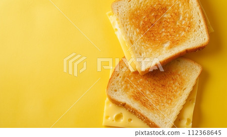 toast with cheese, pastel yellow background,copy space toast with cheese, pastel yellow background,copy space 112368645