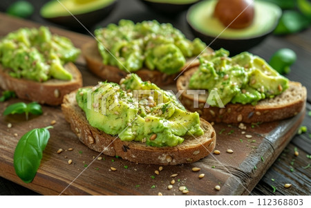 Avocado toast on a wooden cutting board Avocado toast on a wooden cutting board 112368803