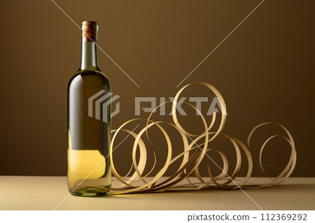Bottle of white wine. Bottle of white wine. 112369292