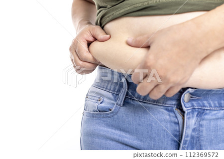 fat woman, fat belly, obese woman hand holding excessive belly fat fat woman, fat belly, obese woman hand holding excessive belly fat 112369572