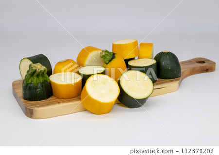 cut green and yellow zucchini 112370202