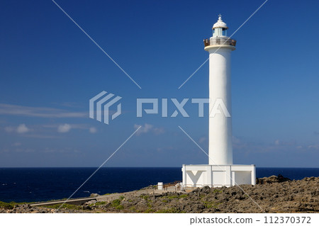 Uza, Yomitan Village, Nakagami District, Okinawa Prefecture: The chalky Cape Zanpa Lighthouse stands at the tip of Cape Zanpa and the blue sea below the cliff. 112370372