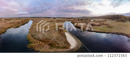 Aerial panorama on river curve in autumn valley 112371563
