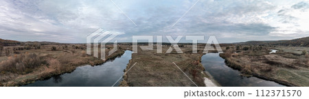 Aerial panorama on river curve in autumn valley Aerial panorama on river curve in autumn valley 112371570