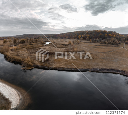 Aerial panorama on river curve in autumn valley 112371574