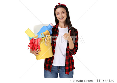 Housewife girl with means for cleaning the house, on a gray background. Housewife girl with means for cleaning the house, on a gray background. 112372189