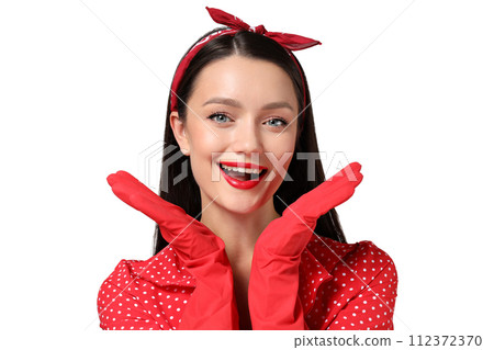 Portrait of a young housewife girl, on a gray background. Portrait of a young housewife girl, on a gray background. 112372370