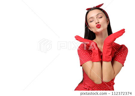 Portrait of a young housewife girl, on a gray background. Portrait of a young housewife girl, on a gray background. 112372374