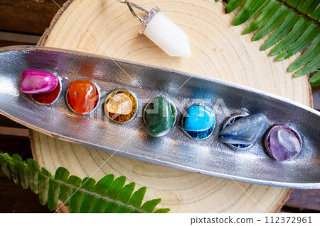 seven chakras stones, energy healing concept 112372961