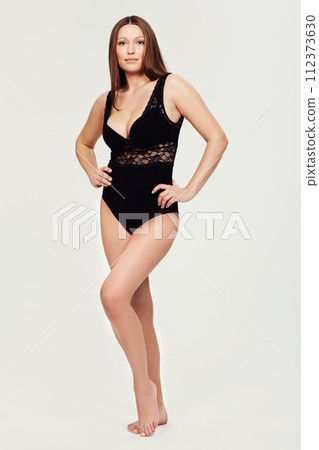 Portrait, body and woman with lingerie in studio for wellness, care or glowing skin on white background. Shape, underwear and female beauty model with confidence, attitude or classy style choice 112373630