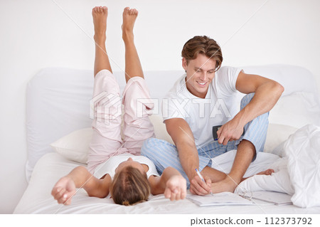 Relaxing, love and young couple on bed in modern apartment writing together in the morning. Happy, calm and man and woman in marriage bonding, talking and drawing in bedroom at home or house. 112373792