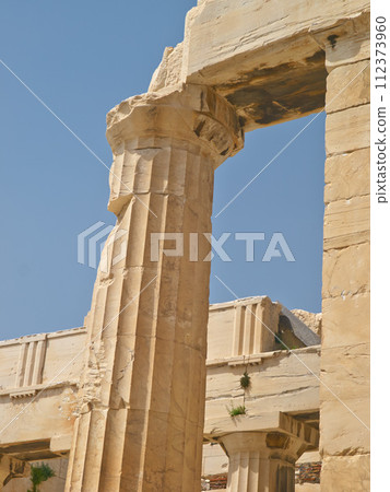 Greek history, ancient pillar or city with keystone arch, architectural detail for tourist attraction site. Traditional, outdoor or crumbling stone of temple building for culture in Acropolis Greece 112373960