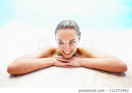 Portrait, edge and woman with a smile, swimming pool and vacation with weekend break, relax and happiness. Face, wet and person with joy, swimming and relax with holiday, getaway trip, calm or summer Portrait, edge and woman with a smile, swimming pool and vacation with weekend break, relax and happiness. Face, wet and person with joy, swimming and relax with holiday, getaway trip, calm or summer 112373962