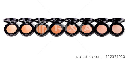 Cosmetics, powder and makeup product for beauty with texture in container, studio and white background. Aesthetic, transformation and choice of shades or colour for application of foundation pallet 112374020