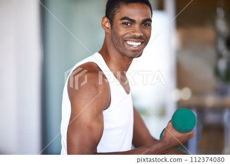 Black man, portrait and smile with dumbbell for exercise, bodybuilding and performance. African person, training and equipment with lifting weights for healthy body, bicep strength and wellness 112374080