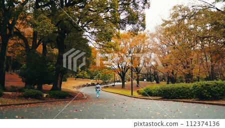 Japanese woman, kimono and walking by trees with autumn leaves and religion for peace in nature. Person, outdoor and wellness by maple tree on journey, back and blue sky in tokyo town in sunlight Japanese woman, kimono and walking by trees with autumn leaves and religion for peace in nature. Person, outdoor and wellness by maple tree on journey, back and blue sky in tokyo town in sunlight 112374136