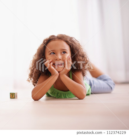 Girl, smile and learning alphabet with blocks in home, child development and growth with letters. Female person, kid and abc on floor of living room, happy and creative game for education with toys Girl, smile and learning alphabet with blocks in home, child development and growth with letters. Female person, kid and abc on floor of living room, happy and creative game for education with toys 112374229