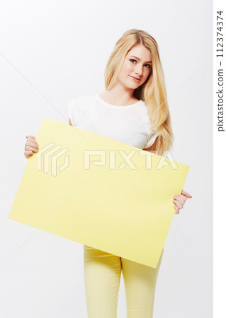 Woman, portrait and placard or mockup space in studio or poster deal for recommendation, communication or white background. Female person, face and blank paper for news bulletin, message or billboard Woman, portrait and placard or mockup space in studio or poster deal for recommendation, communication or white background. Female person, face and blank paper for news bulletin, message or billboard 112374374