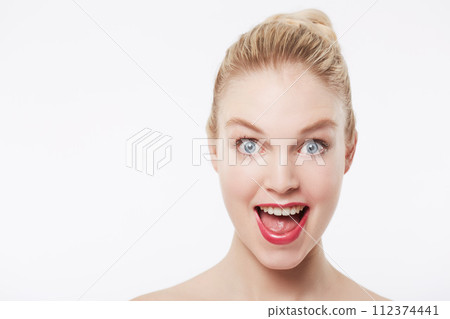 Portrait, skincare and excited woman in red lipstick, makeup and cosmetics in studio isolated on a white background. Shocked face, beauty model and surprise facial treatment, wow and mockup space Portrait, skincare and excited woman in red lipstick, makeup and cosmetics in studio isolated on a white background. Shocked face, beauty model and surprise facial treatment, wow and mockup space 112374441