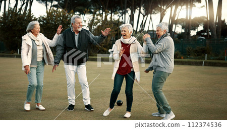 Bowls, celebration and hugging with senior friends outdoor, cheering together during a game. Motivation, support or applause and a group of elderly people clapping while having fun with a hobby 112374536