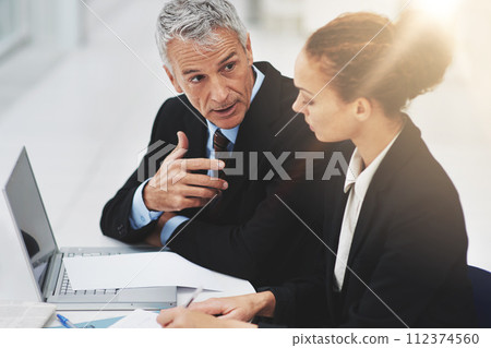Boss, laptop and meeting with employee in office with brainstorming in corporate company. Woman, serious and listening to CEO of business, professional and notebook for planning on desk in workplace Boss, laptop and meeting with employee in office with brainstorming in corporate company. Woman, serious and listening to CEO of business, professional and notebook for planning on desk in workplace 112374560