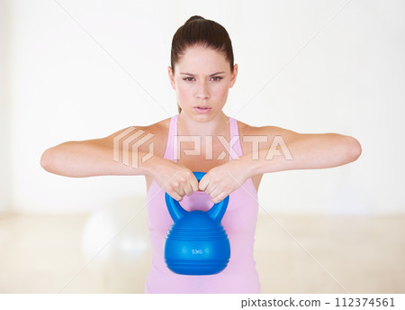 Woman, kettlebell and gym exercise for workout performance, challenge or training. Female person, arms or weightlifting for fitness sport or strong health care, muscle progress, athletic for practice 112374561