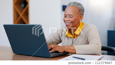 Happy senior woman, laptop and typing in finance with documents for bills or expenses in remote work at home. Mature African female person or freelancer smile on computer in financial budget at house 112374667