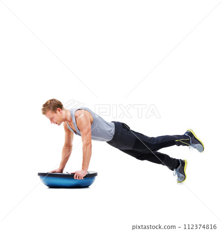 Man, body and push ups on bosu ball for fitness, exercise or workout on a white studio background. Young active male person lifting weight for strength, muscle or strong arms on mockup space 112374816