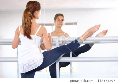 Stretching legs, ballet and girl on mirror in studio, barre and student exercise. Ballerina, young teenager and reflection for flexibility training, dance choreography for performance art and fitness 112374897