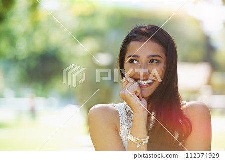 Nature, park and woman happy in environment, smiling and relaxed on vacation in garden for peace. Female person, traveling and enjoyment on holiday in outdoors, adventure and travel to countryside 112374929