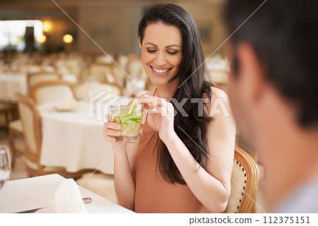 Happy woman, date and drinking alcohol in fine dining, romance or love for anniversary at restaurant. Young woman smile with man on romantic dinner for good beverage, celebration or valentines day Happy woman, date and drinking alcohol in fine dining, romance or love for anniversary at restaurant. Young woman smile with man on romantic dinner for good beverage, celebration or valentines day 112375151