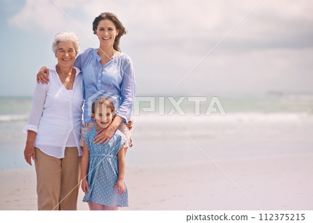 Portrait, smile and family generations on beach in summer together for travel, holiday or vacation. Senior mother, woman parent and girl child bonding on sand by sea or ocean for tropical getaway Portrait, smile and family generations on beach in summer together for travel, holiday or vacation. Senior mother, woman parent and girl child bonding on sand by sea or ocean for tropical getaway 112375215