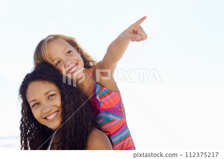 Happy mother, child and pointing on piggyback at beach for exploring or sight on mockup space. Face of mom, daughter or kid smile for vision, adventure or looking in a distance on a sky background 112375217
