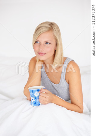 Morning, tea and woman relax in bed and thinking in home planning ideas for future. Healthy, person and calm girl with coffee in bedroom on holiday, vacation or wellness from rest in apartment 112375374