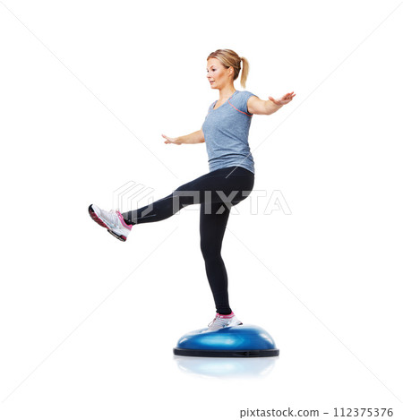 Woman, bosu ball or leg balance in studio workout for development isolated on white background. Female athlete, training equipment or fitness for mockup space, body challenge or exercise for wellness Woman, bosu ball or leg balance in studio workout for development isolated on white background. Female athlete, training equipment or fitness for mockup space, body challenge or exercise for wellness 112375376