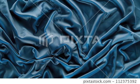 Advertising close-up shot of texture of blue tone perfect natural velvet fabric chaotically crumpled 112375392