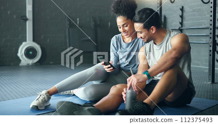 Smartphone, fitness and personal trainer talking to client for exercise goal planning on mobile app, internet search or health software. Young sports people on floor in conversation and using phone 112375493