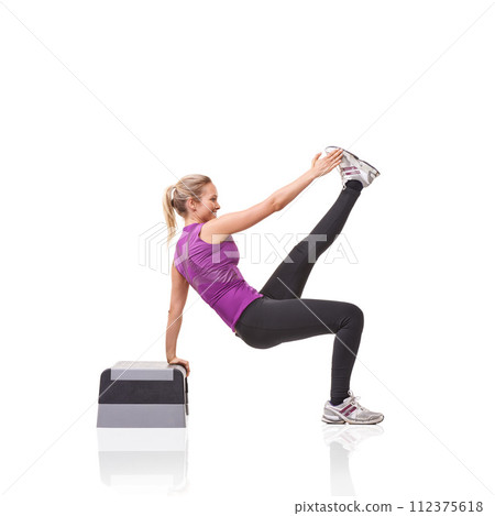 Woman, aerobics step and training in studio profile with smile, exercise or health by white background. Girl, person and mockup space for workout, fitness or wellness on floor with balance for muscle 112375618