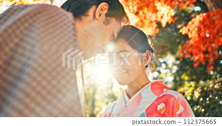 Couple, forehead touch and sunshine with love in park, Japanese people together on date with love and affection. Lens flare, summer and man with woman outdoor, commitment and loyalty with peace 112375665