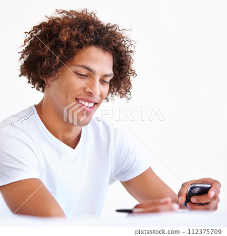 Man, phone and writing notes for message or reminder in studio, email and information on white background. Male person, contact and networking or online research, tech and connection to internet 112375709