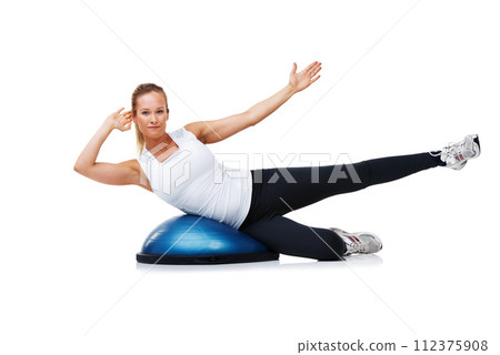 Fitness, half ball and portrait of woman in a studio for stretching body workout or training with balance. Sports, equipment and young female person with muscle warm up exercise by white background. Fitness, half ball and portrait of woman in a studio for stretching body workout or training with balance. Sports, equipment and young female person with muscle warm up exercise by white background. 112375908
