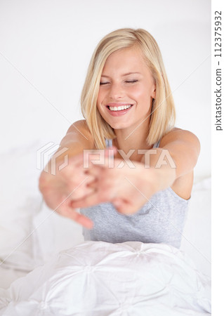 Happy, woman and wake up stretching on bed in morning with peace and wellness in home. Calm, girl and relax in bedroom on holiday or vacation with healthy routine and self care in house or apartment Happy, woman and wake up stretching on bed in morning with peace and wellness in home. Calm, girl and relax in bedroom on holiday or vacation with healthy routine and self care in house or apartment 112375932