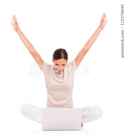 Woman, laptop and celebration or excited in studio with arms up for good news, promotion or winning. Female person, online and white background with mockup or announcement victory, reward or lottery 112376040