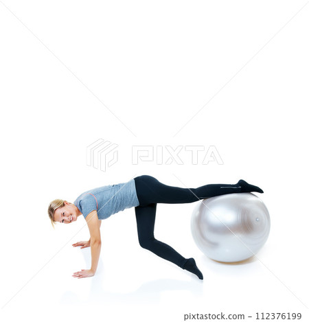 Happy woman, fitness and exercise ball for balance, workout or health and wellness on a white studio background. Female person or athlete smile on round object for training or pilates on mockup space 112376199