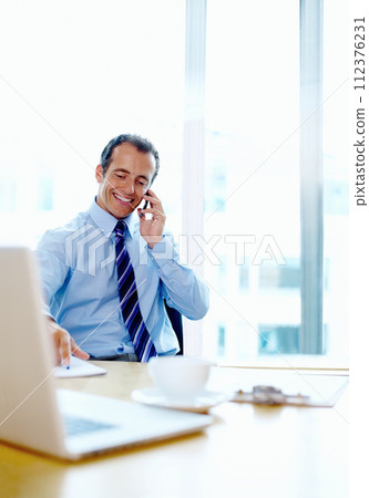 Happy businessman, phone call and discussion at office for communication, proposal or networking. Man or employee smile talking on mobile smartphone for business or online conversation at workplace 112376231