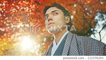 Man in garden, Asian and peace, thinking about life with reflection and tranquility in traditional clothes. Travel, Japanese park and nature for fresh air, inspiration or insight with sunshine Man in garden, Asian and peace, thinking about life with reflection and tranquility in traditional clothes. Travel, Japanese park and nature for fresh air, inspiration or insight with sunshine 112376263
